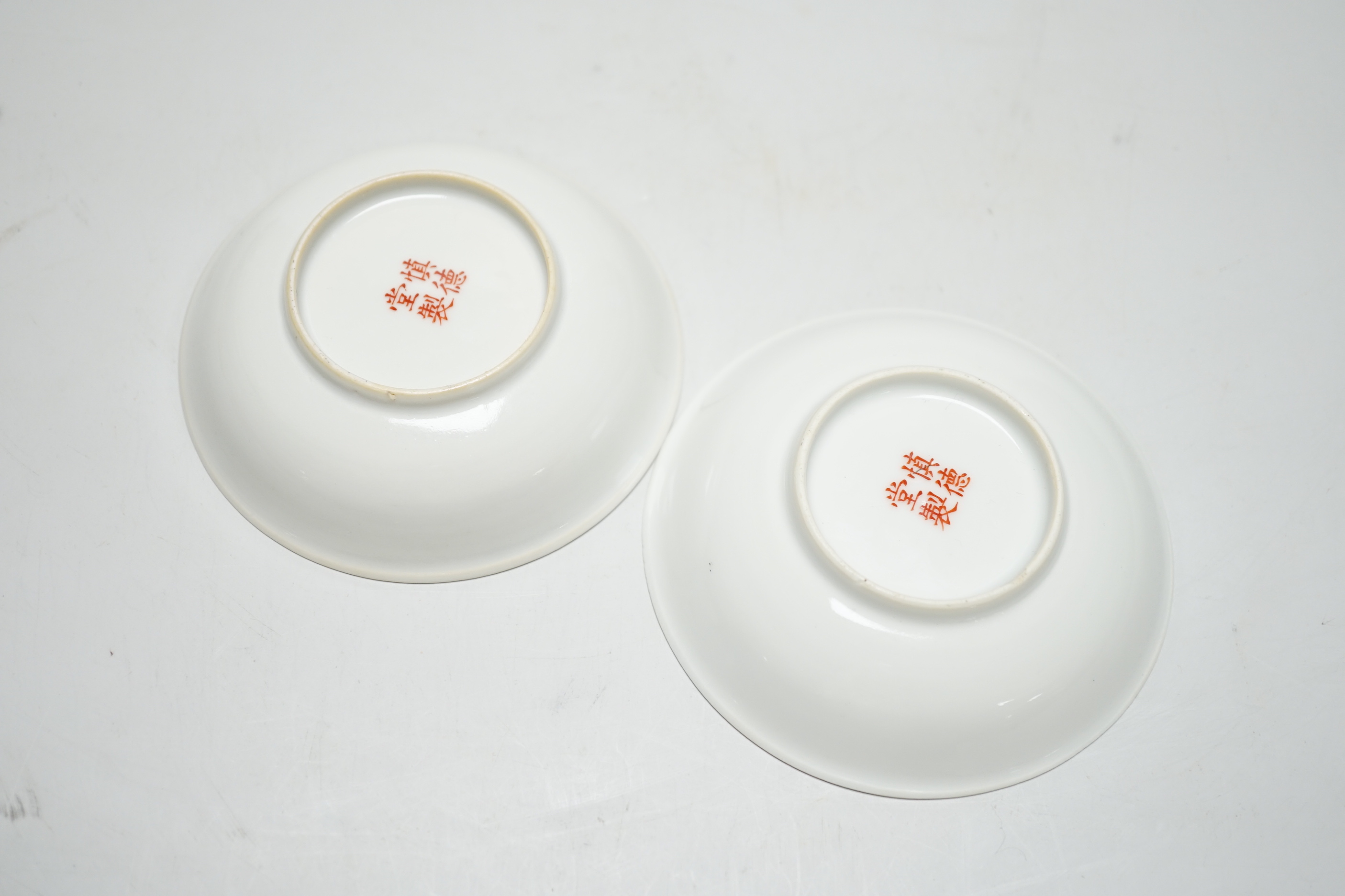 A pair of Chinese calligraphic enamelled porcelain saucers, 9.5cm